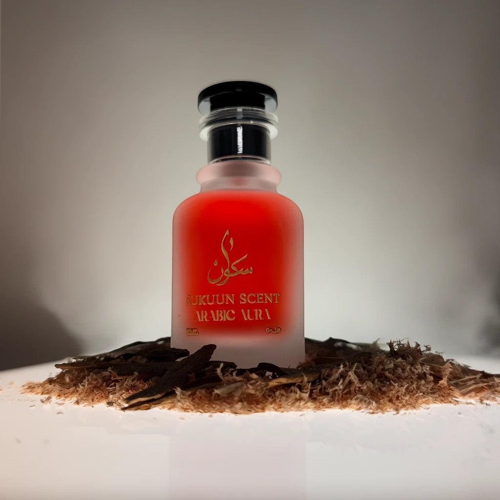 Sukuun Scent Arabic Aura Eau de Parfum 50ML, a red frosted glass bottle with gold Arabic script and text.