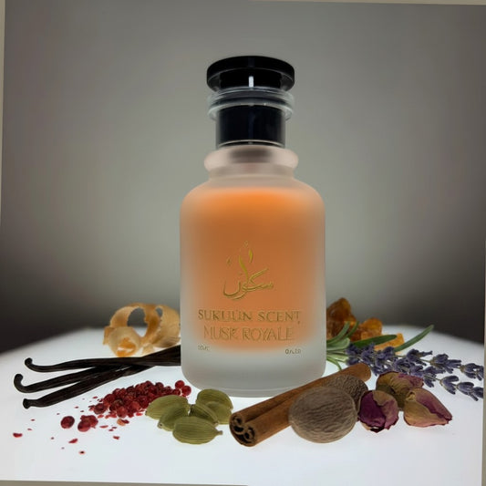 Sukuun Scent Musk Royale Eau de Parfum 50ML frosted glass bottle with gold lettering and orange liquid.