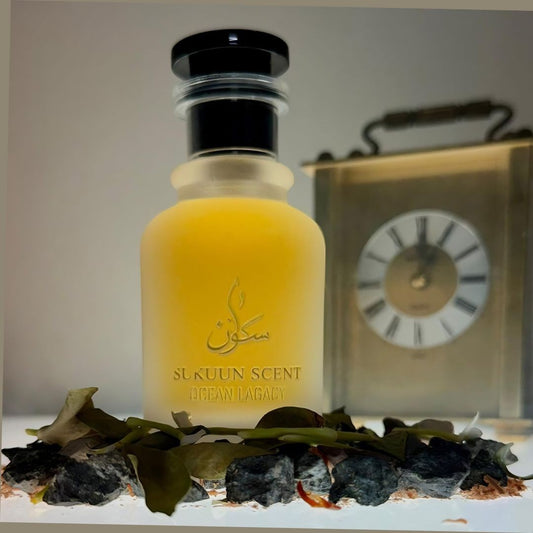 Sukuun Scent Ocean Legacy Eau de Parfum 50ML bottle with aquatic-woody notes, displayed with rocks and foliage.