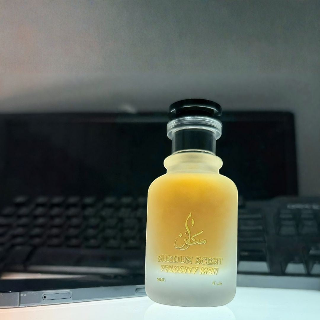 Sukuun Scent Velocity Men Eau De Parfum in a frosted glass bottle with gold accents. Citrus and spice fragrance.