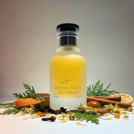 Sukuun Scent Wild Crown Eau De Parfum in a frosted glass bottle with a black cap. The golden label reads "SUKUUN SCENT WILD CROWN 50ML".